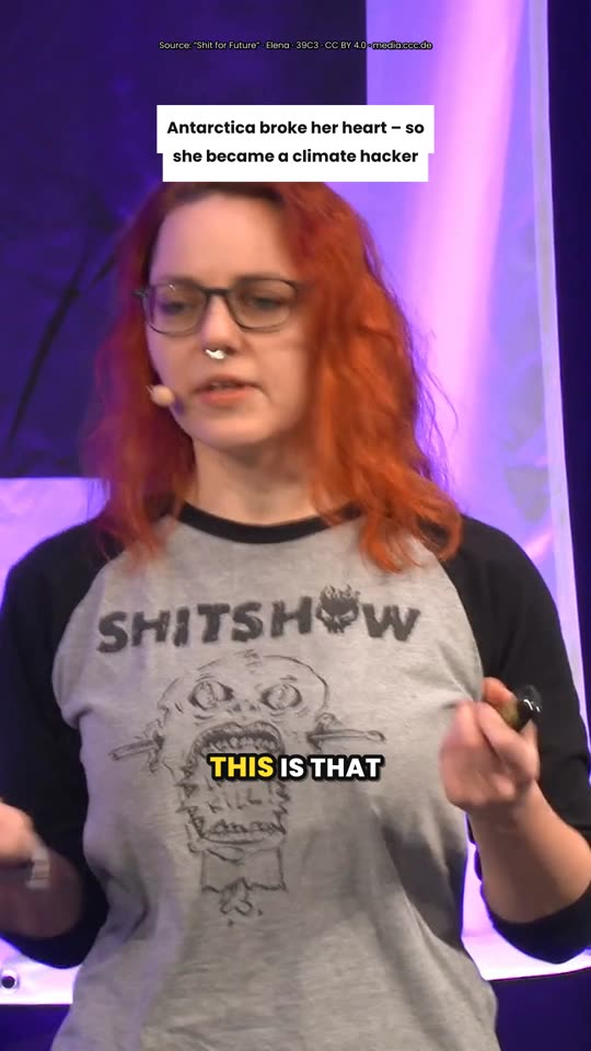 Speaker on stage with burned-in English captions